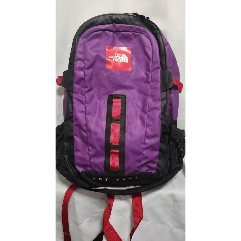 hot pink and black north face backpack The Women's Borealis Cyber Berry/Sumac a rounded back panel The North Face Pink &